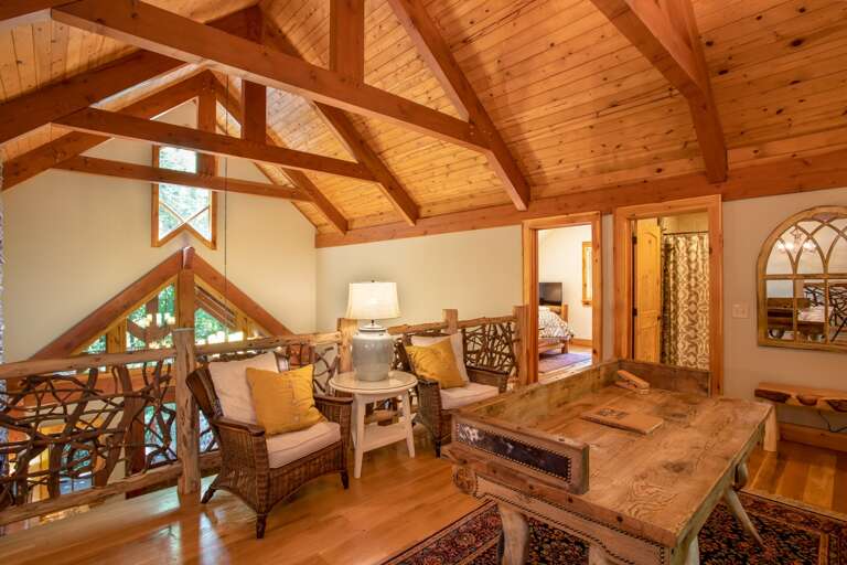 Loft also offers comfy armchair seating, open to Great Room below