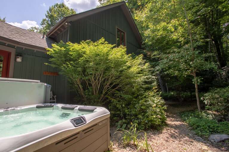 Private Hot Tub on Back of House, Surrounded by Thick Landscaping