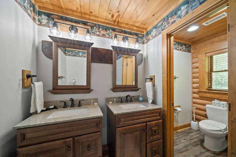 Ensuite Bathroom with Two Vanities and Tub and Shower Combo in the Water Room