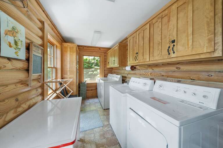 Laundry Room with Two Sets of Washers and Dryers