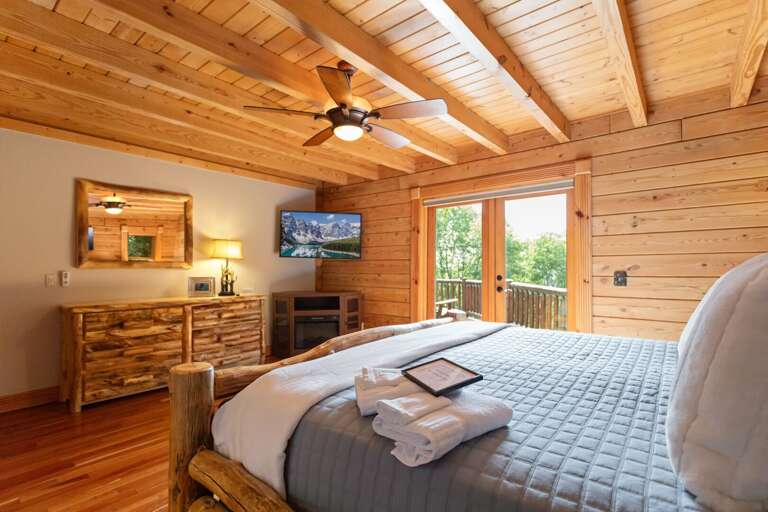 King Suite with TV and Door onto the Deck