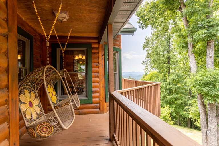 The Chair Swings Overlook the Expansive Yard The Chair Swings Overlook the Expansive Yard