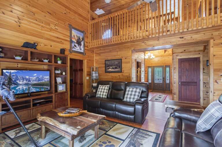 Leather Couches and Flat Screen TV with and Custom Live Edge Wood Tables Leather Couches and Flat Screen TV with and Custom Live Edge Wood Tables