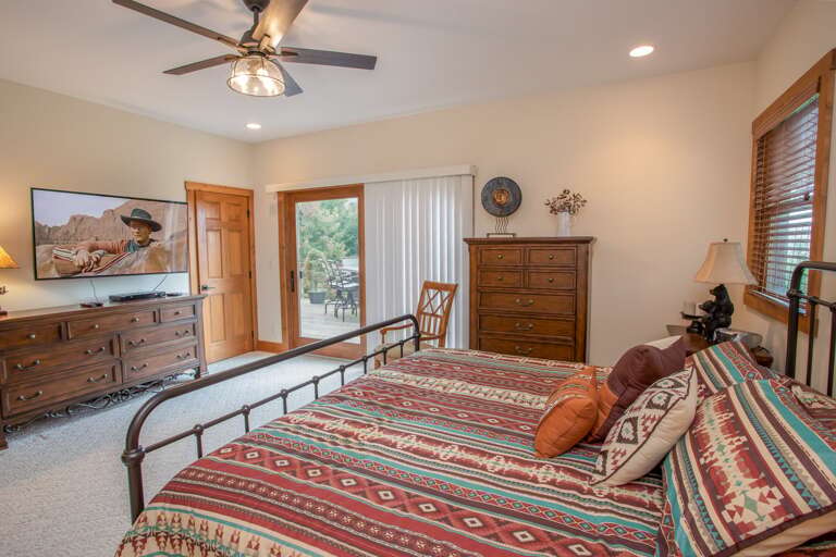 King Master Bedroom on Main Floor with Deck Access and Smart TV and ensuite private bathroom