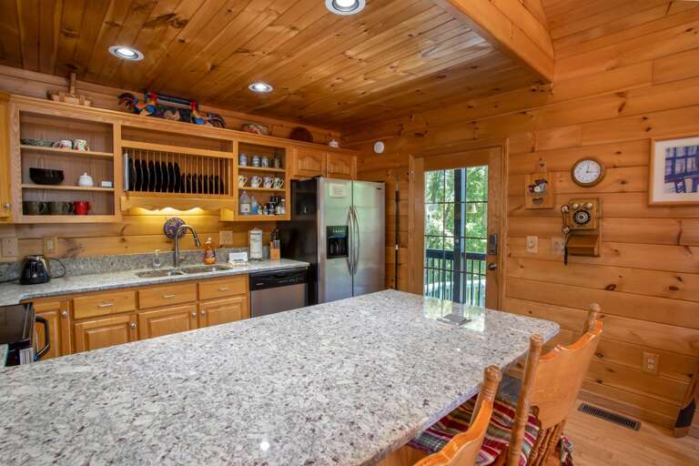 Kitchen with Large Bar Top and Bar Stool Seating