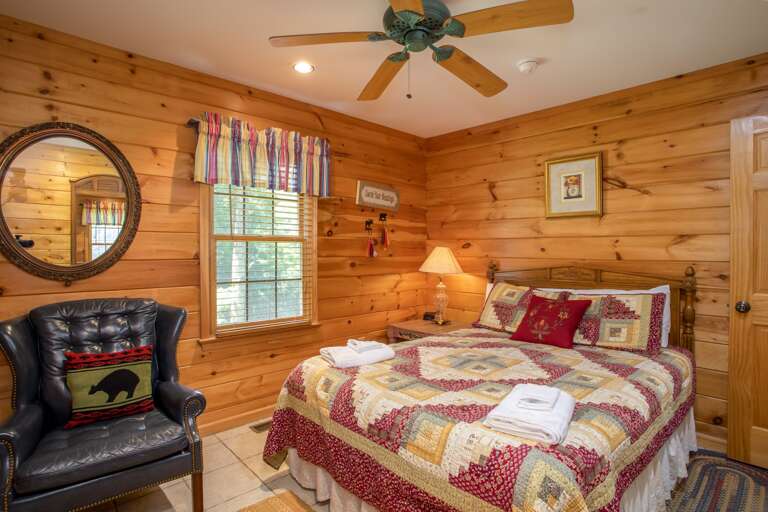 Main Level Queen Bedroom with Leather Armchair and HD Smart TV (not pictured)