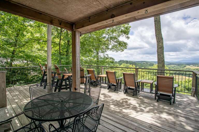 Large Deck on Main Level, with Plenty of seating, a second Dining Table, and Priceless Mountain Views!