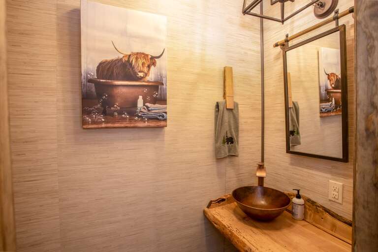 Half Bathroom on Main Level with Live Edge Countertop and Hammered Copper Vessel Sink