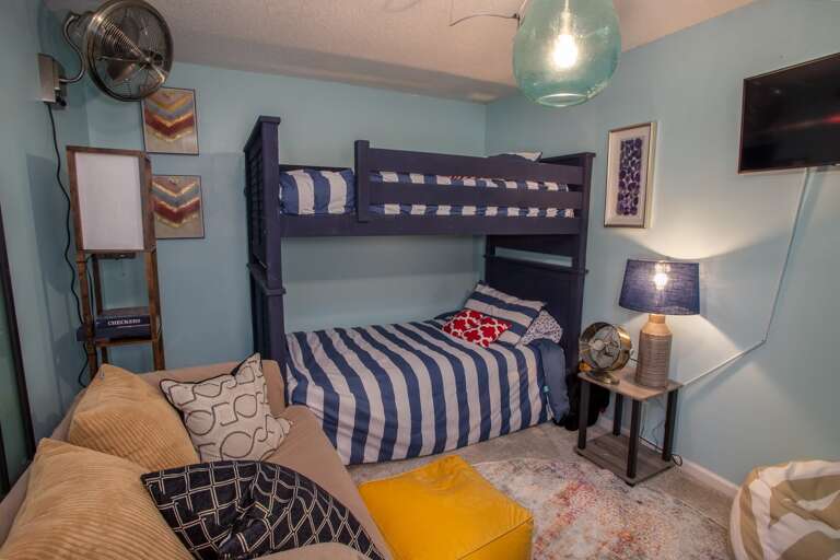 Bunk Bedroom offers two Twin over Twin bunk beds, Comfy Loveseat, and HD Smart TV