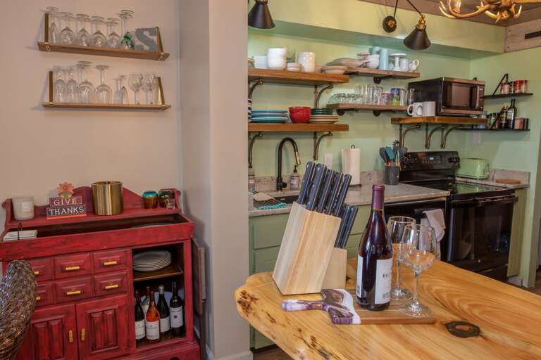Custom Open Shelving stocked liberally with Glassware, Flatware, Plates, Bowls, and more!