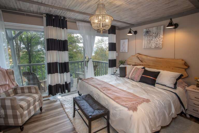 King Master Bedroom Suite boasts artistic Live Edge Headboard and Comfy Armchair