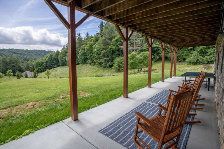 Lower Level Courtyard off of Den and Game Room, with Rocking Chairs, facing Mountain and Valley Views!