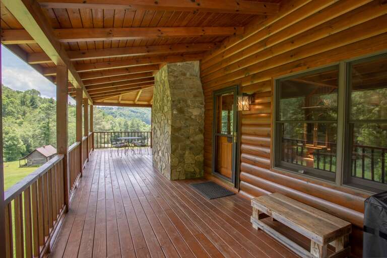 Long Side Porch on Main Level with Door into Dining Area, offers Lots of Room for Outdoor Activities - even on Rainy Days!