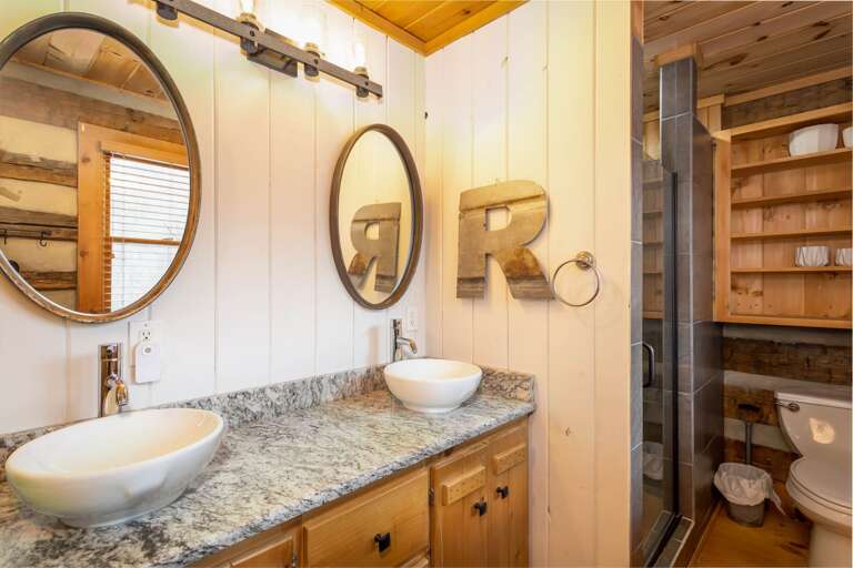 Granite Vanity Counter with His & Hers Vessel Sinks in Main Level Full Bathroom Granite Vanity Counter with His & Hers Vessel Sinks in Main Level Full Bathroom