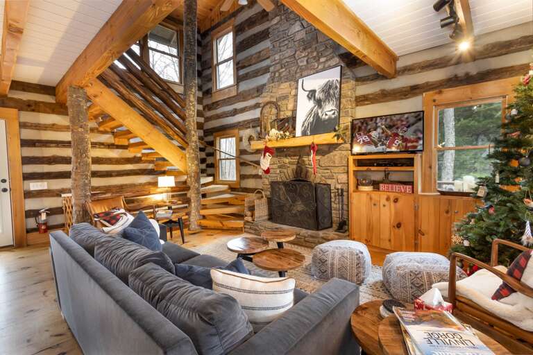 Great Room with Floor-to-Ceiling Stone Wood-Burning Fireplace and HD Smart TV Great Room with Floor-to-Ceiling Stone Wood-Burning Fireplace and HD Smart TV