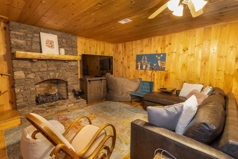 Lower Level Family Room with Stone Gas Fireplace and HD Smart TV Lower Level Family Room with Stone Gas Fireplace and HD Smart TV