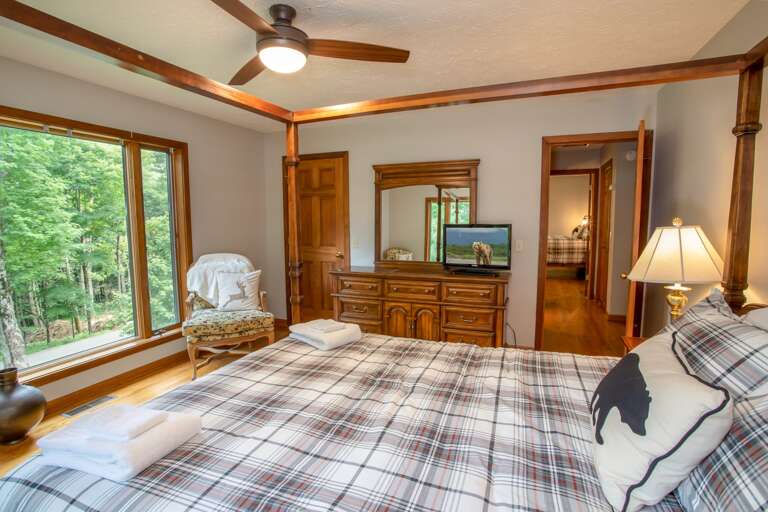 Main Floor Queen #1 with TV and large windows