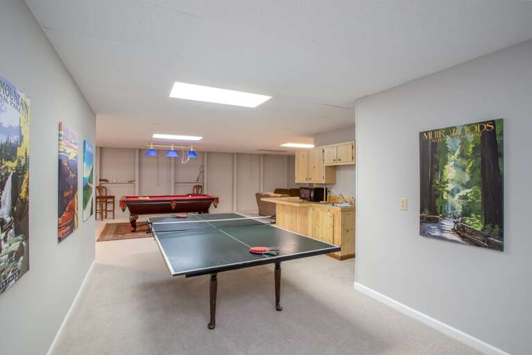 Massive game room with ping pong, pool table, and foosball table