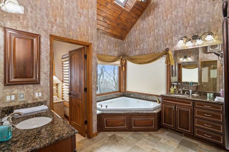 Large Master Bathroom has Double Vanities, Step in Shower and Soaking Tub with Mountain View