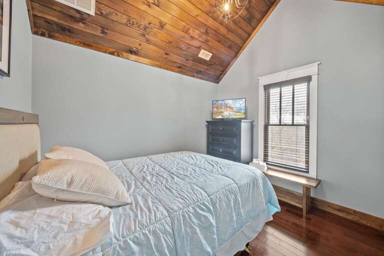 Queen Bed and TV in an Upper Level Bedroom