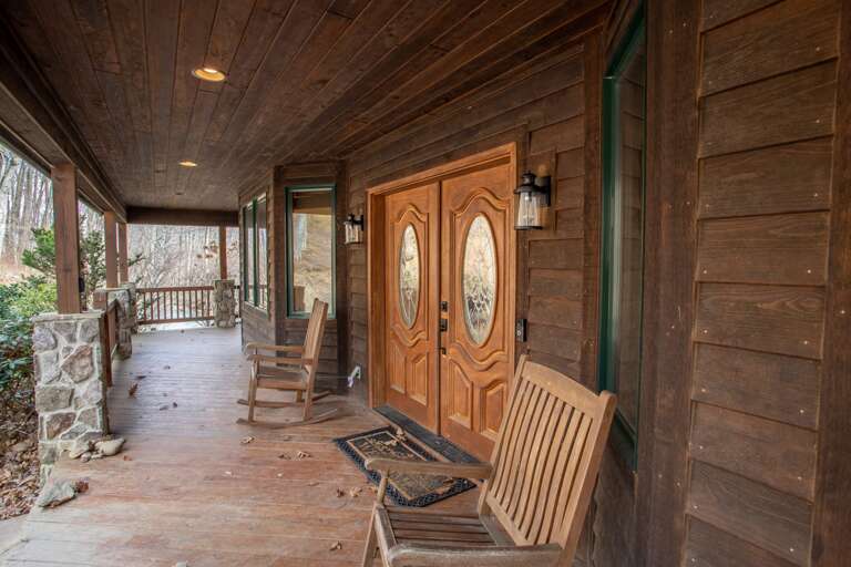 Expansive Covered Front Porch and Front Door with Flanking Rockers