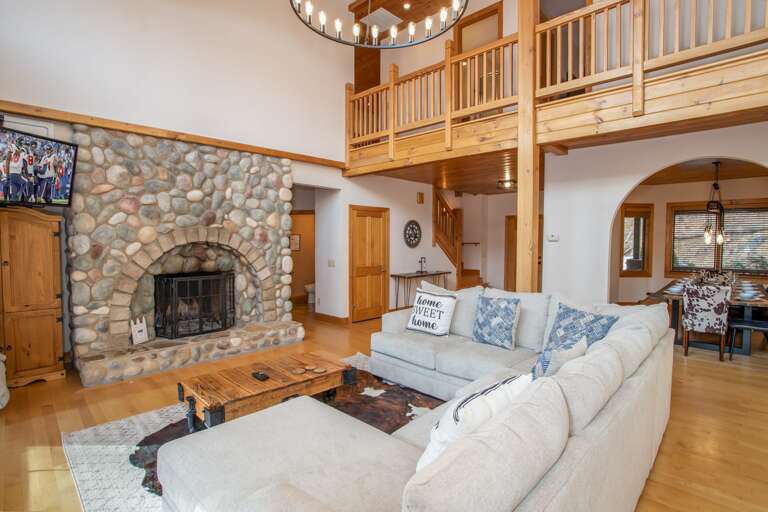 Great Room with Soaring Cathedral Ceilings and HD Smart TV