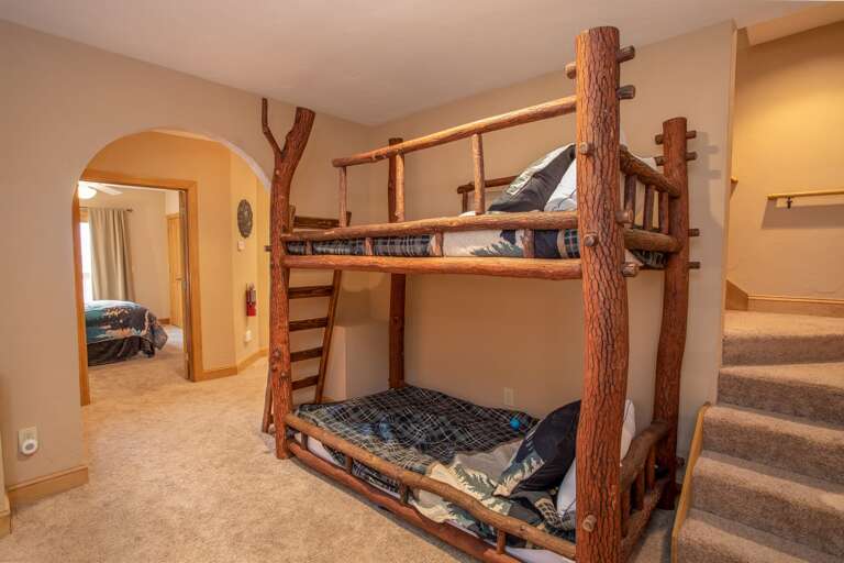 Lower Level Bunk Alcove with Custom Log Twin XL over Twin XL Beds