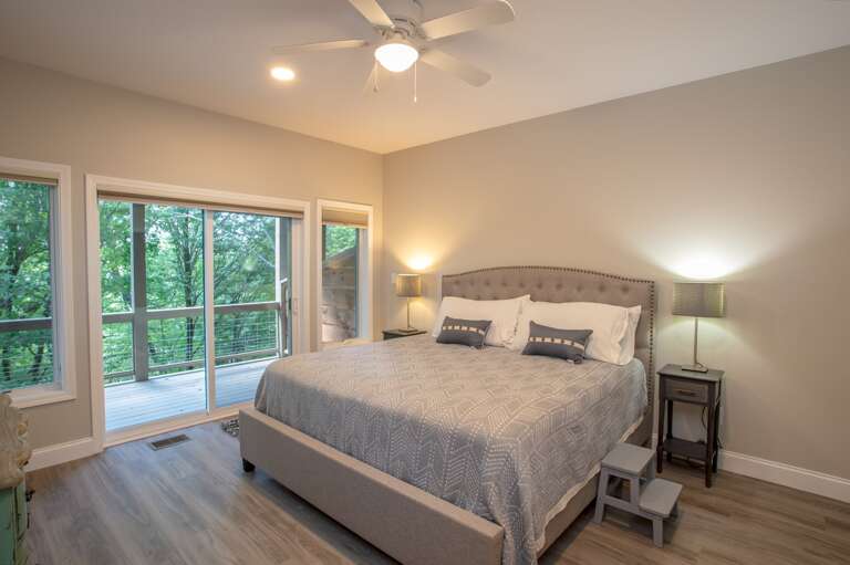 King bedroom on lower level with deck King bedroom on lower level with deck