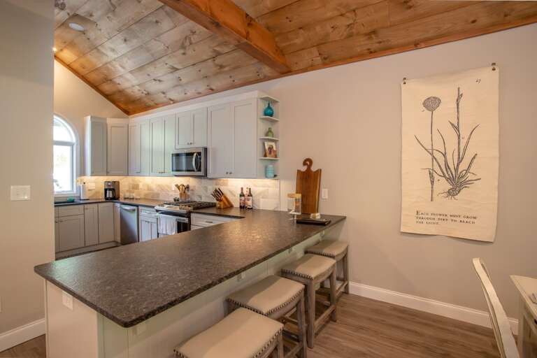 Kitchen and seating at the bar top Kitchen and seating at the bar top