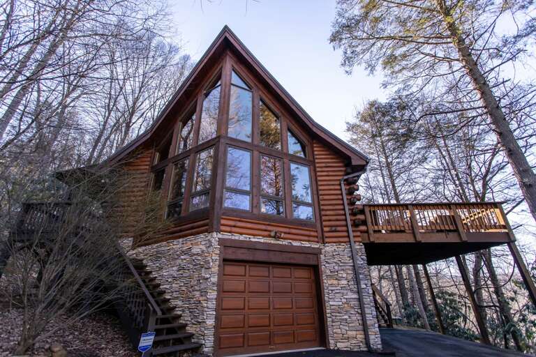 Huge Wall of Windows provide loads of sunlight into the open floor plan on Main and Upper Levels!