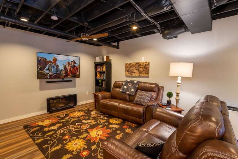 Media Nook on Lower Level with comfy seating, Electric Fireplace, and Large HD Smart TV