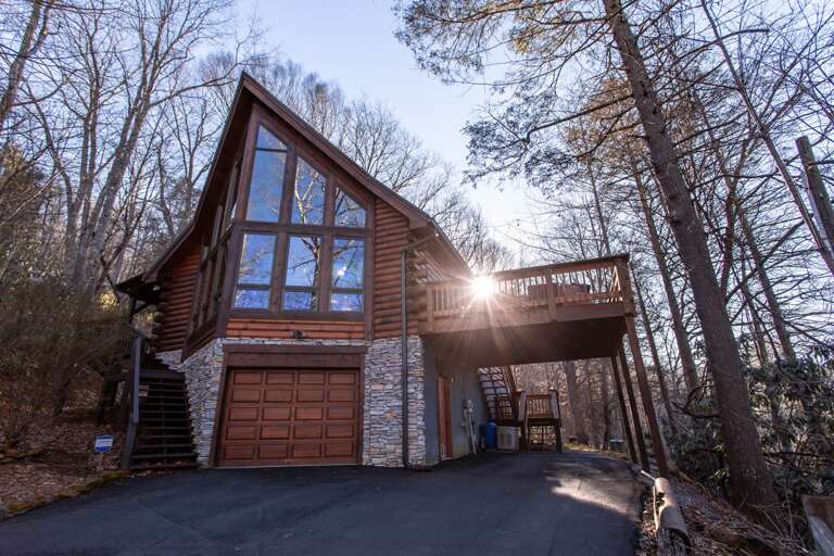 Paved Driveway with One Car Garage and Covered Carport Parking
