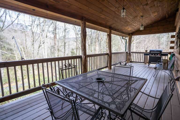 Gas Grill and Outdoor Table on the Covered Porch