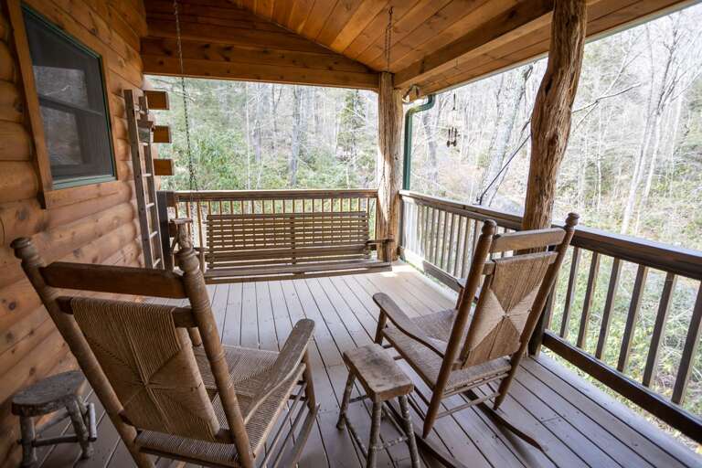 Main Floor Deck with a Wooded View Overlooking the Property