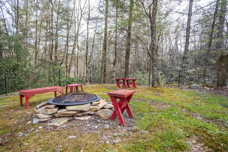 Wood Burning Fire Pit with Seating on Stacked Stones