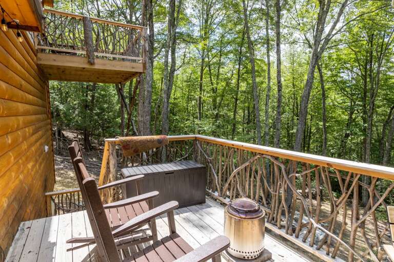 Gas Fire Pit and Rocking Chairs on the Deck with Wooded View