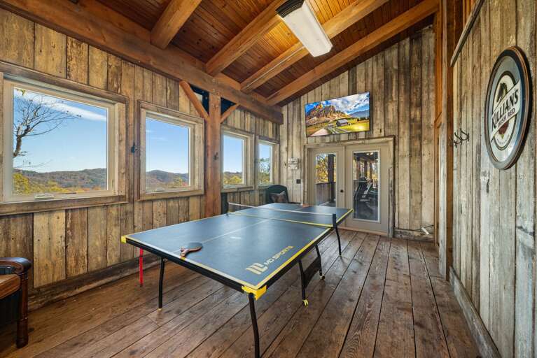 Ping Pong Table in the Enclosed Porch with Access to Main Level Deck