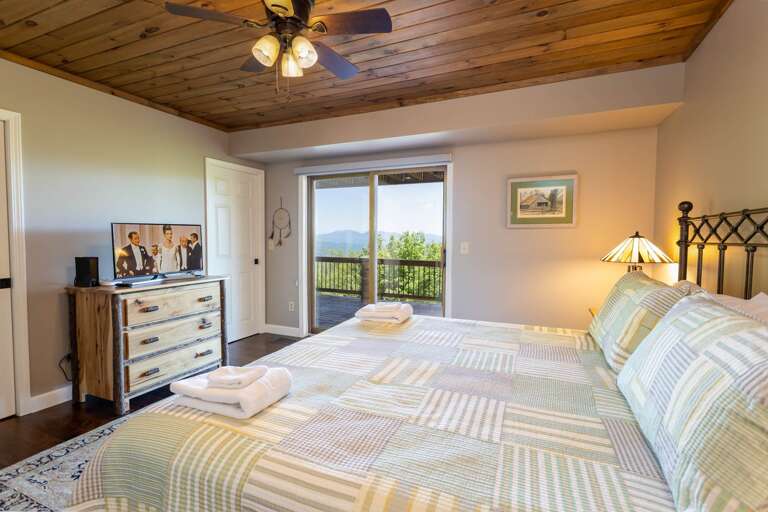 King Suite with Private Bathroom and Deck Access in the Middle Level King Suite with Private Bathroom and Deck Access in the Middle Level