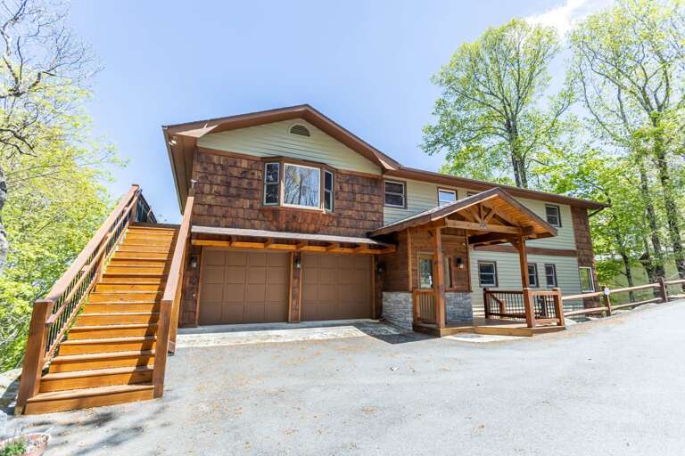 Level Parking and Front Entry with Stairs to Top Level Deck Level Parking and Front Entry with Stairs to Top Level Deck