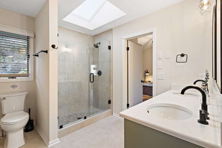 Jack-and-Jill Bathroom with Step in Tiled Shower and Double Vanity Jack-and-Jill Bathroom with Step in Tiled Shower and Double Vanity