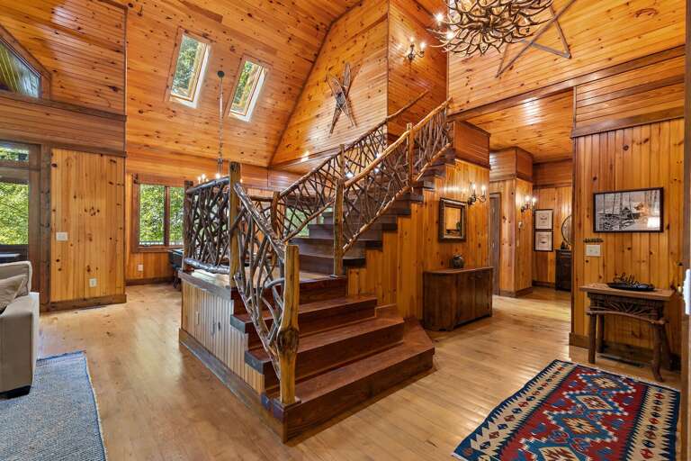 Foyer, Hall to the Master Bedroom and Stairs Leading to Upper Suite
