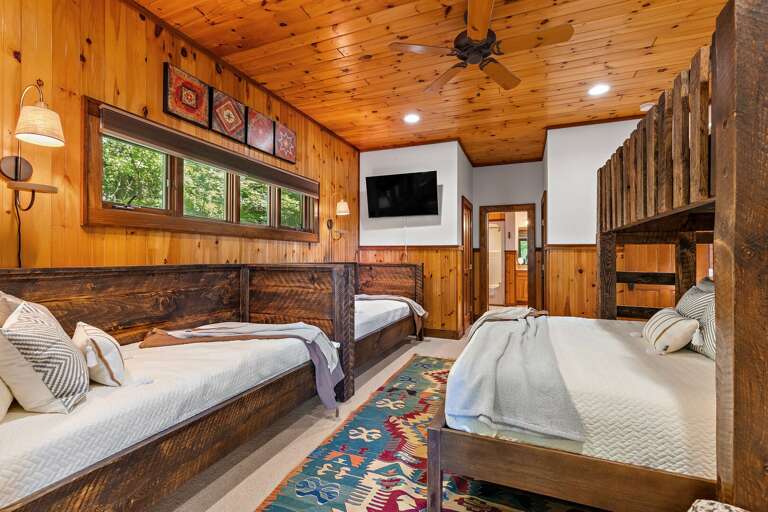 Lower Level Suite Includes TV, Deck Access, and Private Bathroom