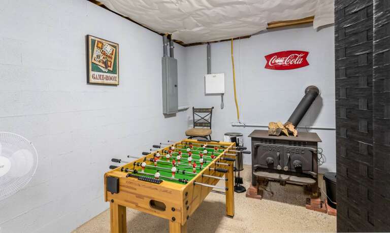 Foosball Table and Buck Wood Stove in the the Basement Game Room Foosball Table and Buck Wood Stove in the the Basement Game Room