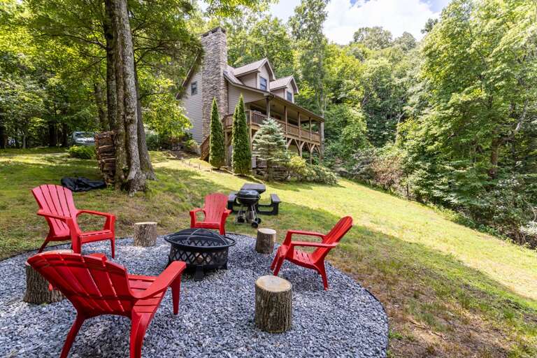 Sloping Yard with Wood Burning Fire Pit, Charcoal Grill and Picnic Table Sloping Yard with Wood Burning Fire Pit, Charcoal Grill and Picnic Table