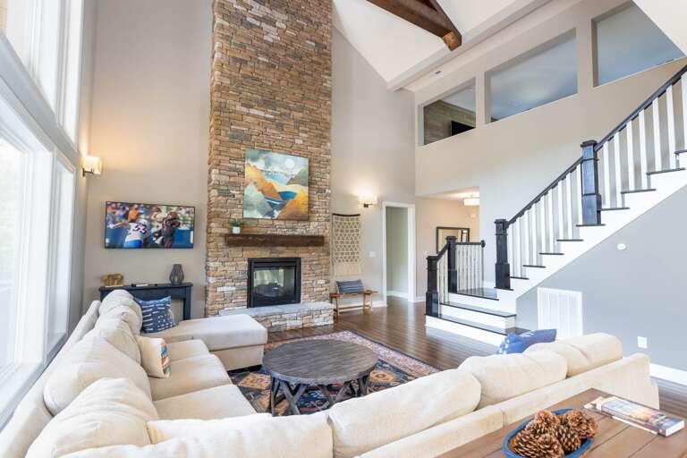 Stacked Stone Pass Through Gas Fireplace and TV in the Living Room