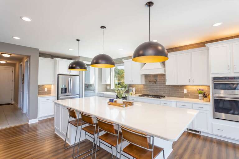 Stainless Appliances and Kitchen Island with Seating