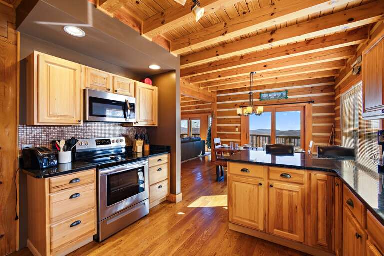 Kitchen, Dining and Deck Beyond