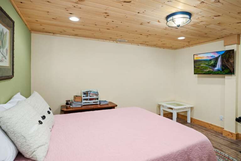 Queen Bed and TV in the Lower Level Bedroom