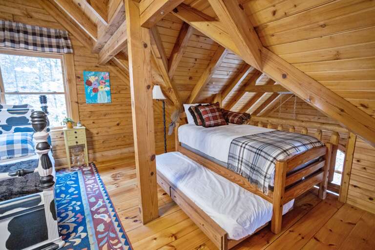 Twin Bed with a Trundle in an Open Loft Upstairs Room