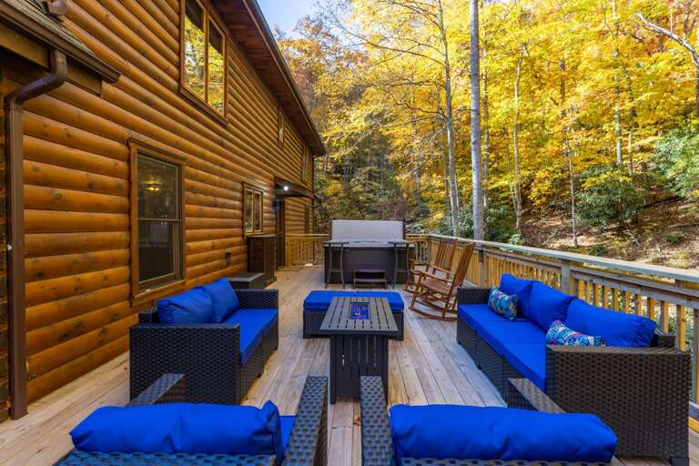 Deck with Gas Fire Table, Hot Tub, and Cushioned Furniture Deck with Gas Fire Table, Hot Tub, and Cushioned Furniture